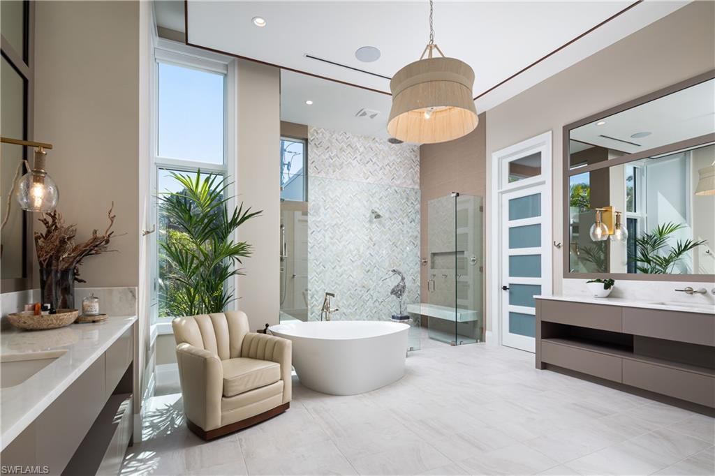 441 Mooring Line Drive Naples, FL 34102 - Photo 26 of 50 a living room with furniture and a large window