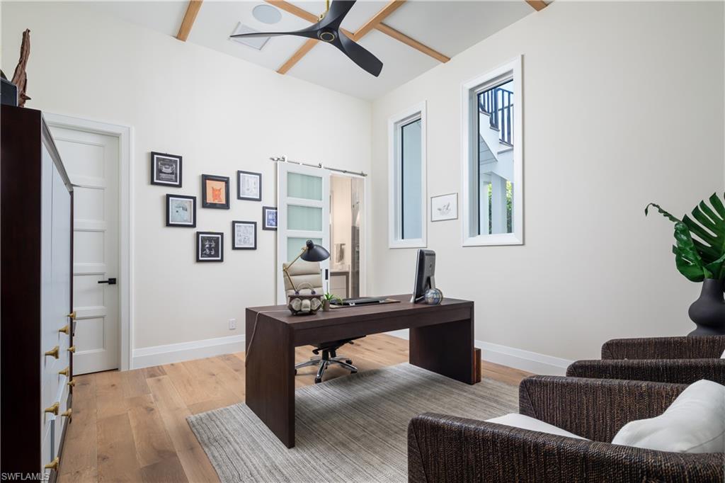 441 Mooring Line Drive Naples, FL 34102 - Photo 28 of 50 a living room with furniture and a window