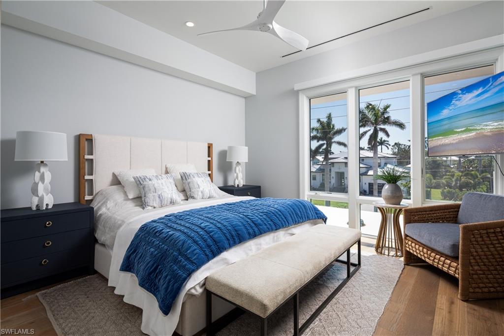 441 Mooring Line Drive Naples, FL 34102 - Photo 41 of 50 a bedroom with a bed and a couch