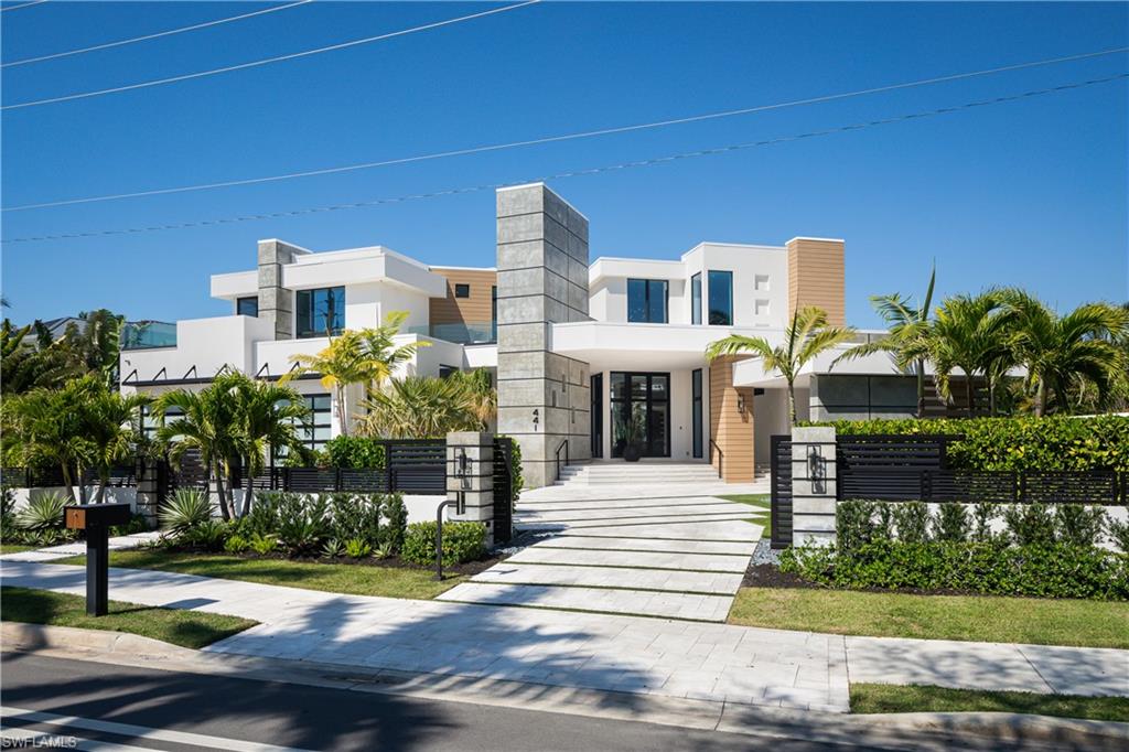 441 Mooring Line Drive Naples, FL 34102 - Photo 47 of 50 a front view of a house with a garden