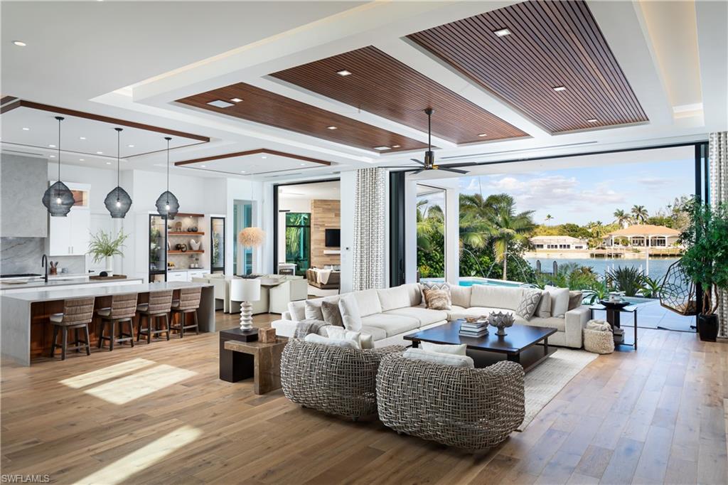 441 Mooring Line Drive Naples, FL 34102 - Photo 5 of 50 a living room with furniture and a large window