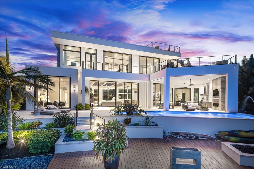 441 Mooring Line Drive Naples, FL 34102 - Photo 7 of 50 a view of a building with sitting area
