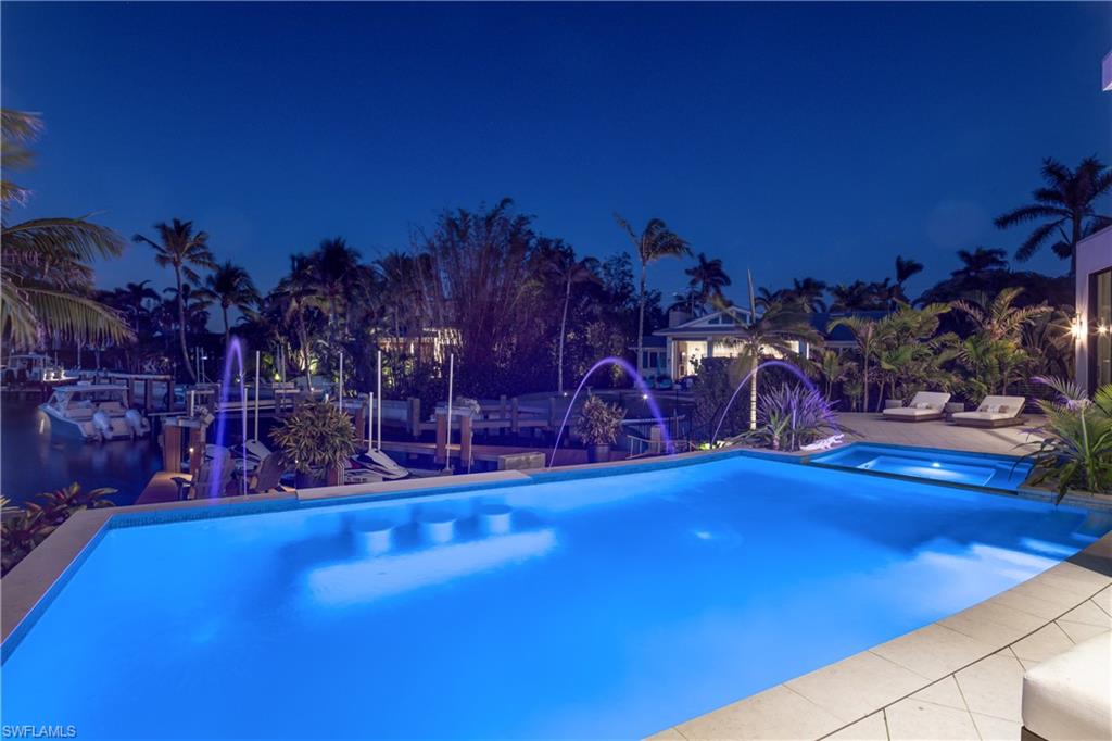 441 Mooring Line Drive Naples, FL 34102 - Photo 10 of 50 a view of a room with lots of green space