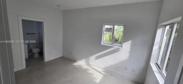 an empty room with windows