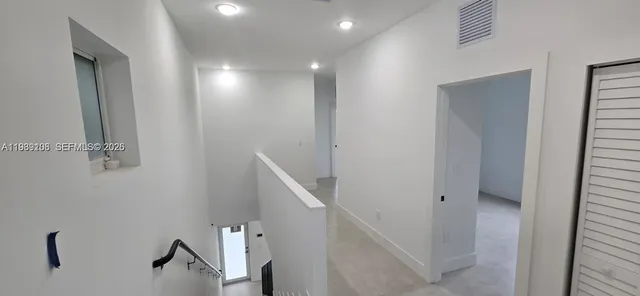 a view of hallway with stairs