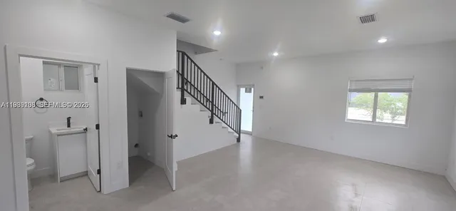 a view of an entryway with stairs