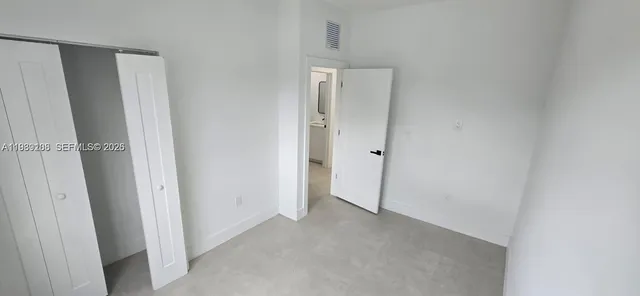 a view of a closet area with front door