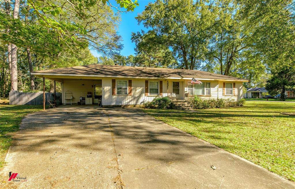 400 Bennett Street Mansfield, LA 71052 - Photo 1 of 1 Ranch-style house featuring a carport and a front yard