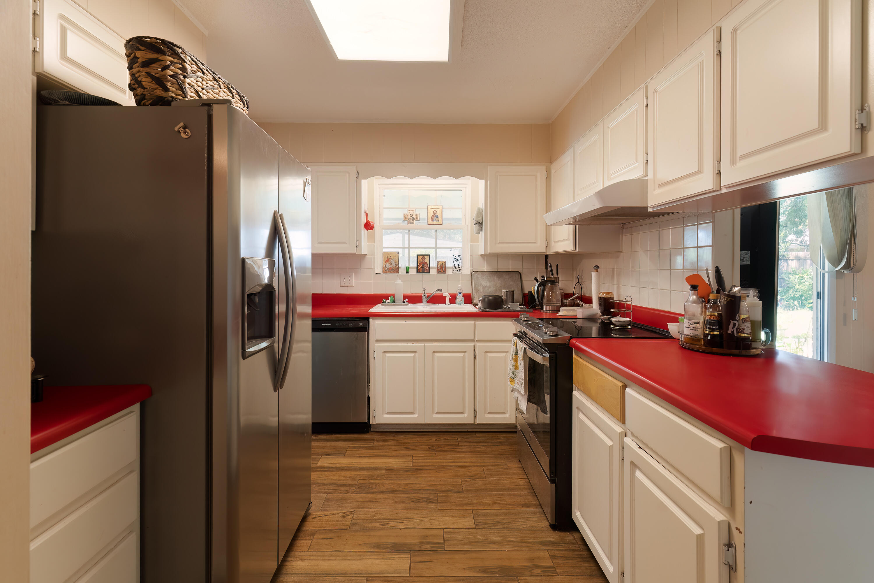 35 James Avenue Shalimar, FL 32579 - Photo 11 of 44 a kitchen with stainless steel appliances a refrigerator sink and cabinets