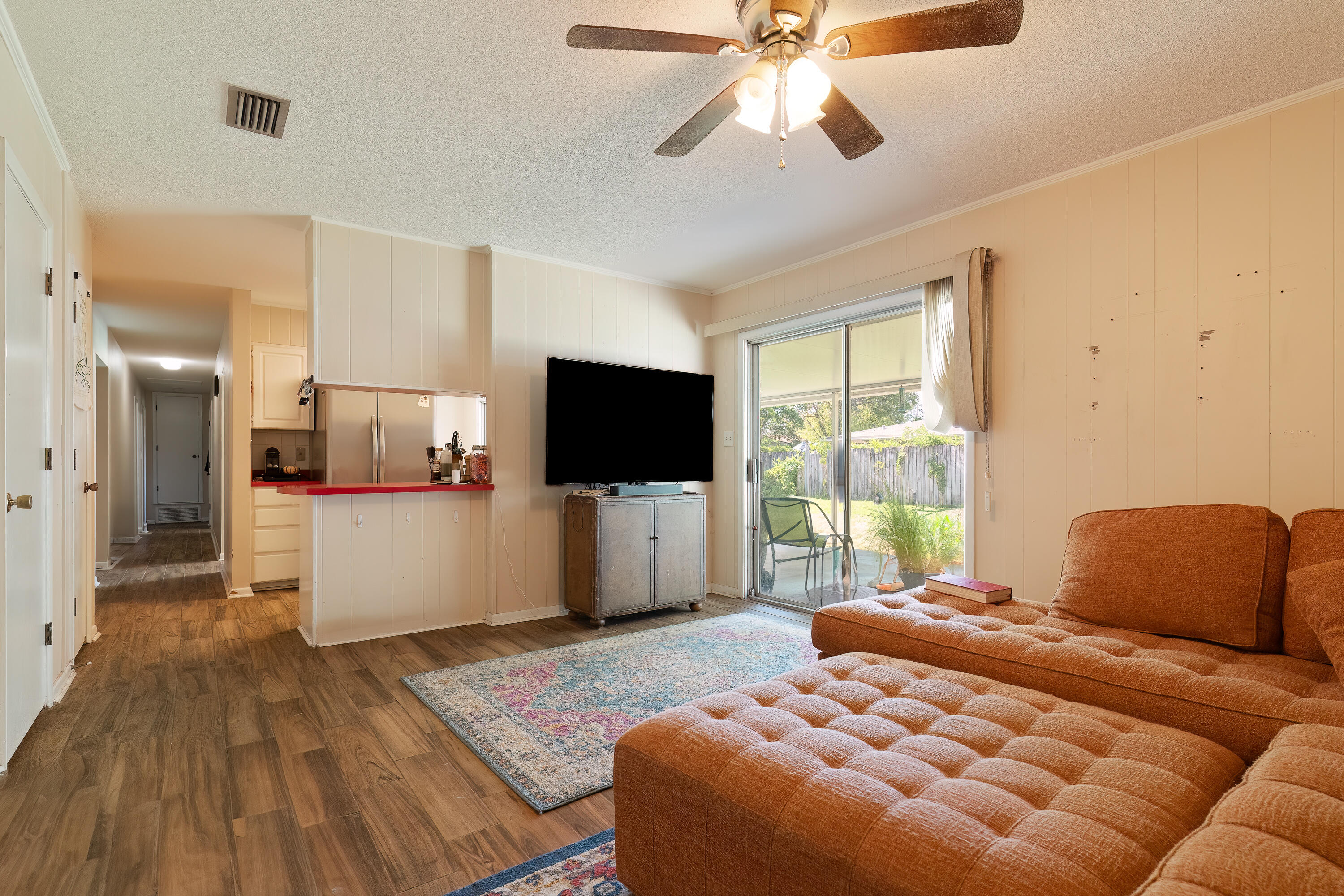 35 James Avenue Shalimar, FL 32579 - Photo 23 of 44 a bedroom with a large bed and a flat screen tv