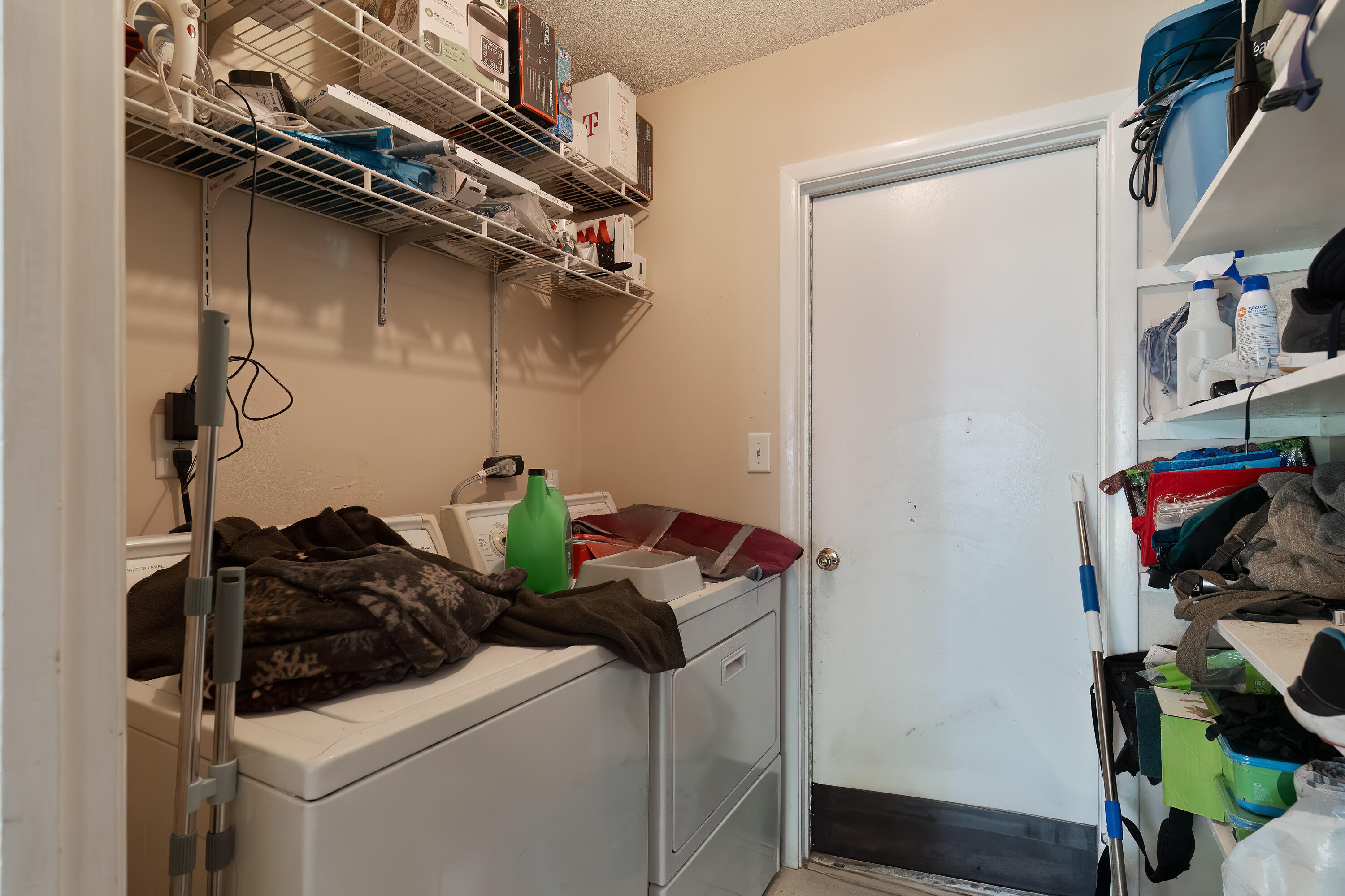 35 James Avenue Shalimar, FL 32579 - Photo 24 of 44 a close view of shoes with washer and dryer