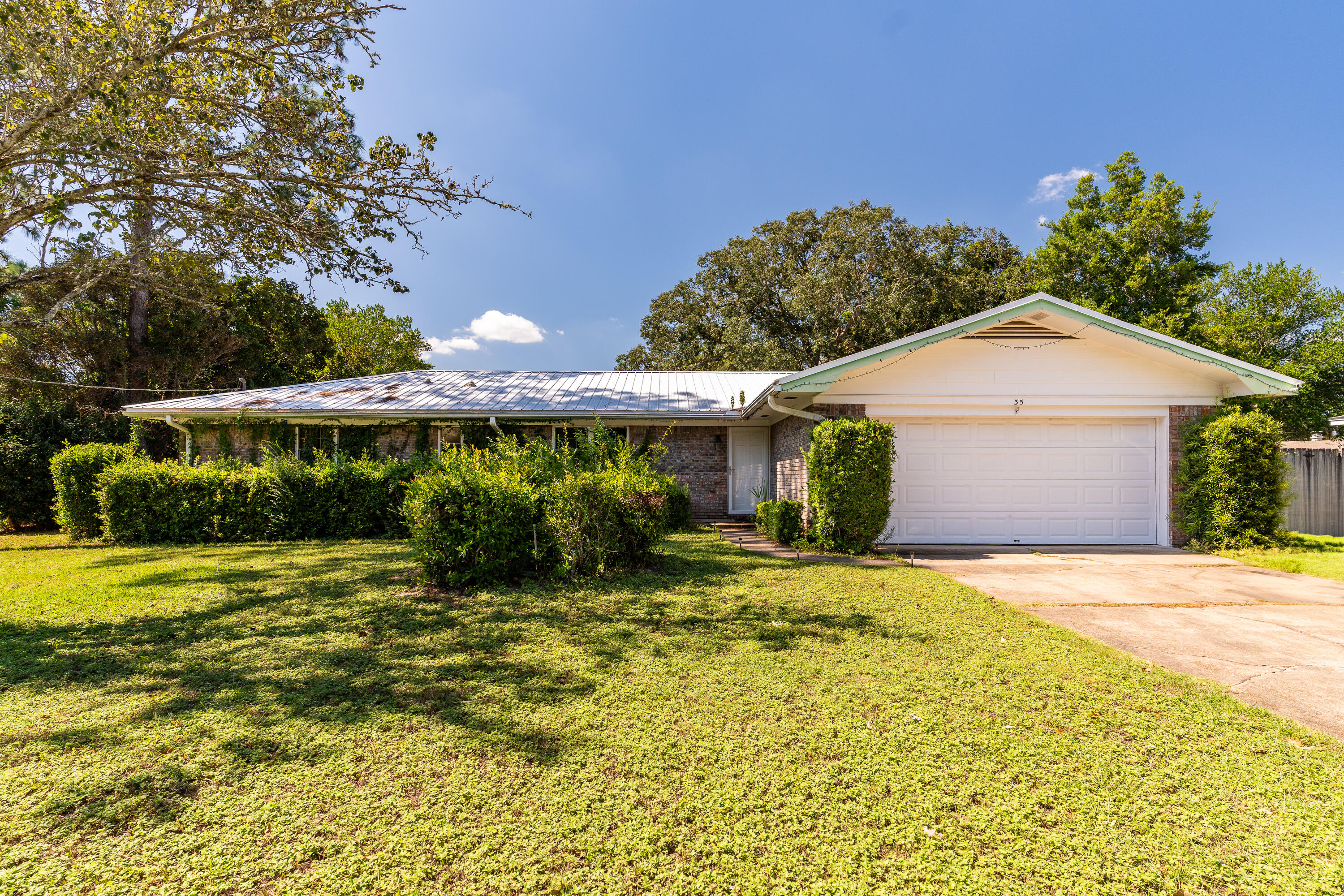35 James Avenue Shalimar, FL 32579 - Photo 27 of 44 a front view of a house with a yard