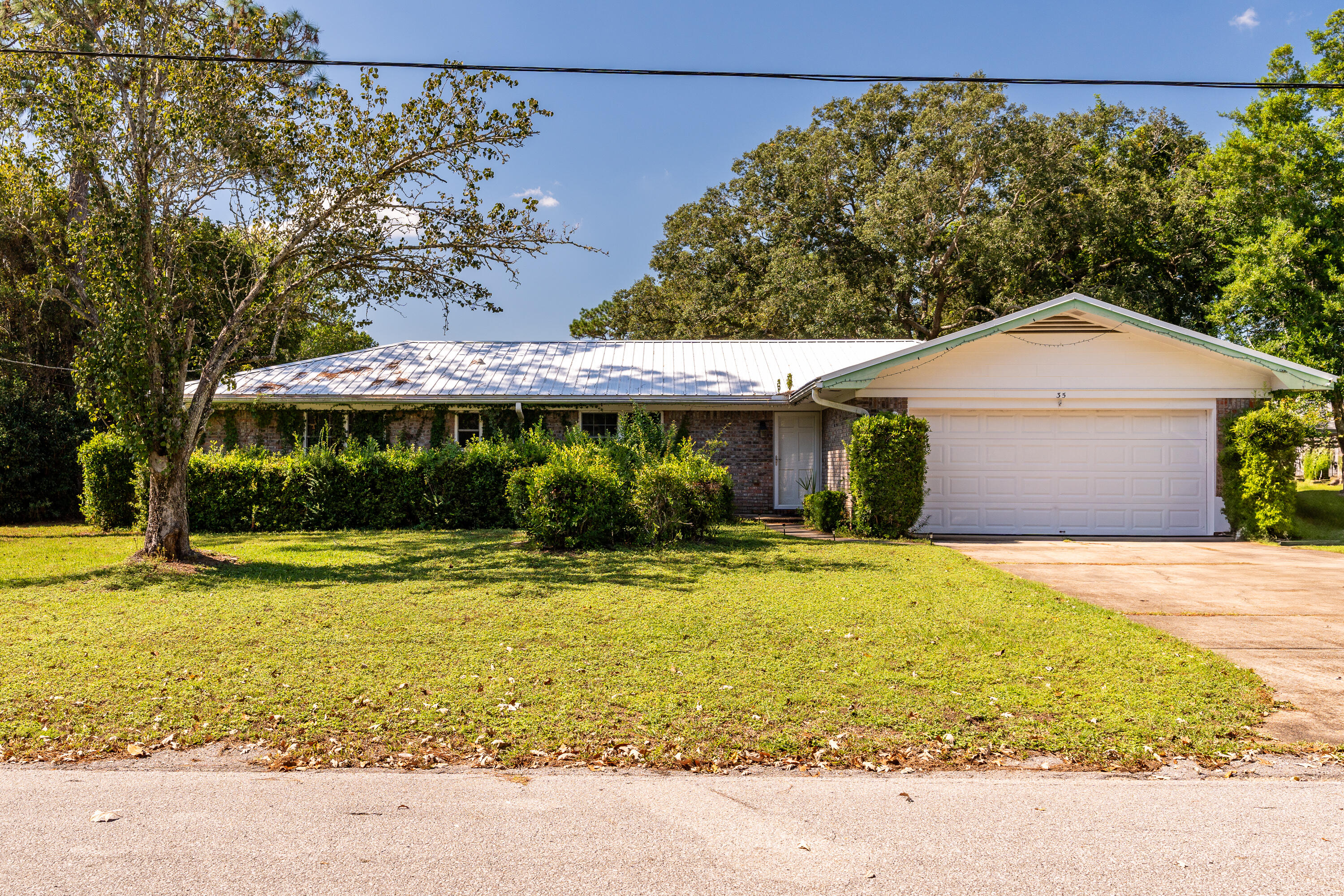 35 James Avenue Shalimar, FL 32579 - Photo 29 of 44 a view of a house with swimming pool and a yard