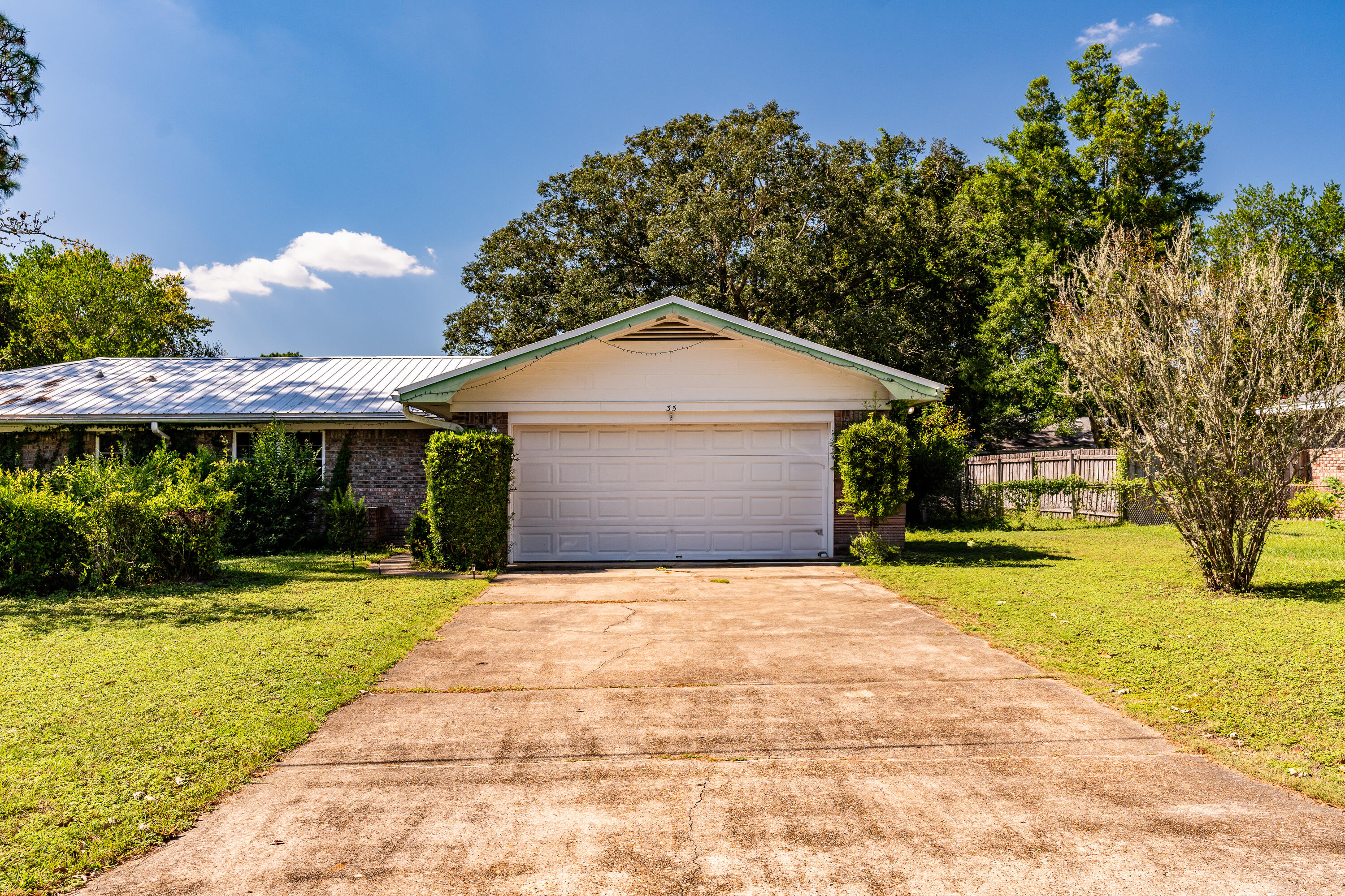35 James Avenue Shalimar, FL 32579 - Photo 30 of 44 a front view of house with yard and green space