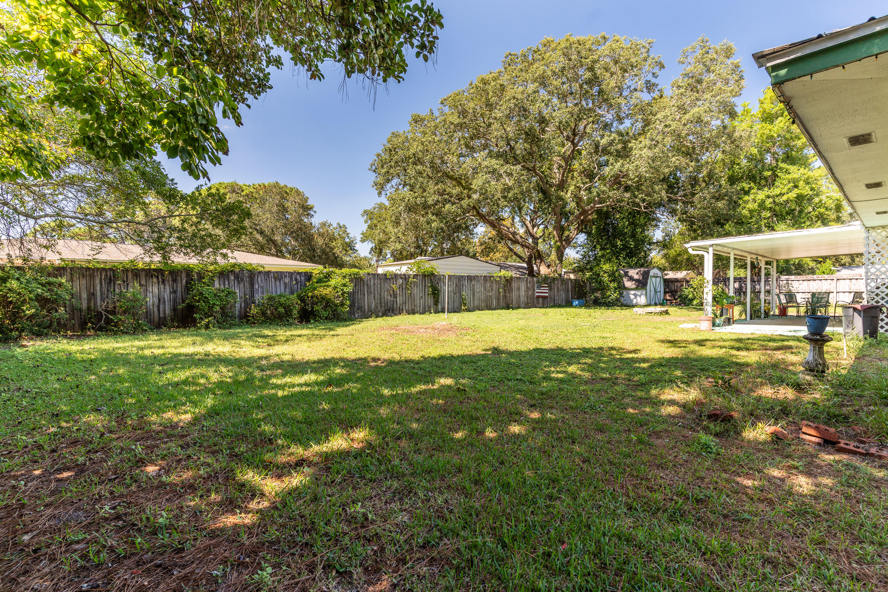 35 James Avenue Shalimar, FL 32579 - Photo 31 of 44 a swimming pool with outdoor seating and yard
