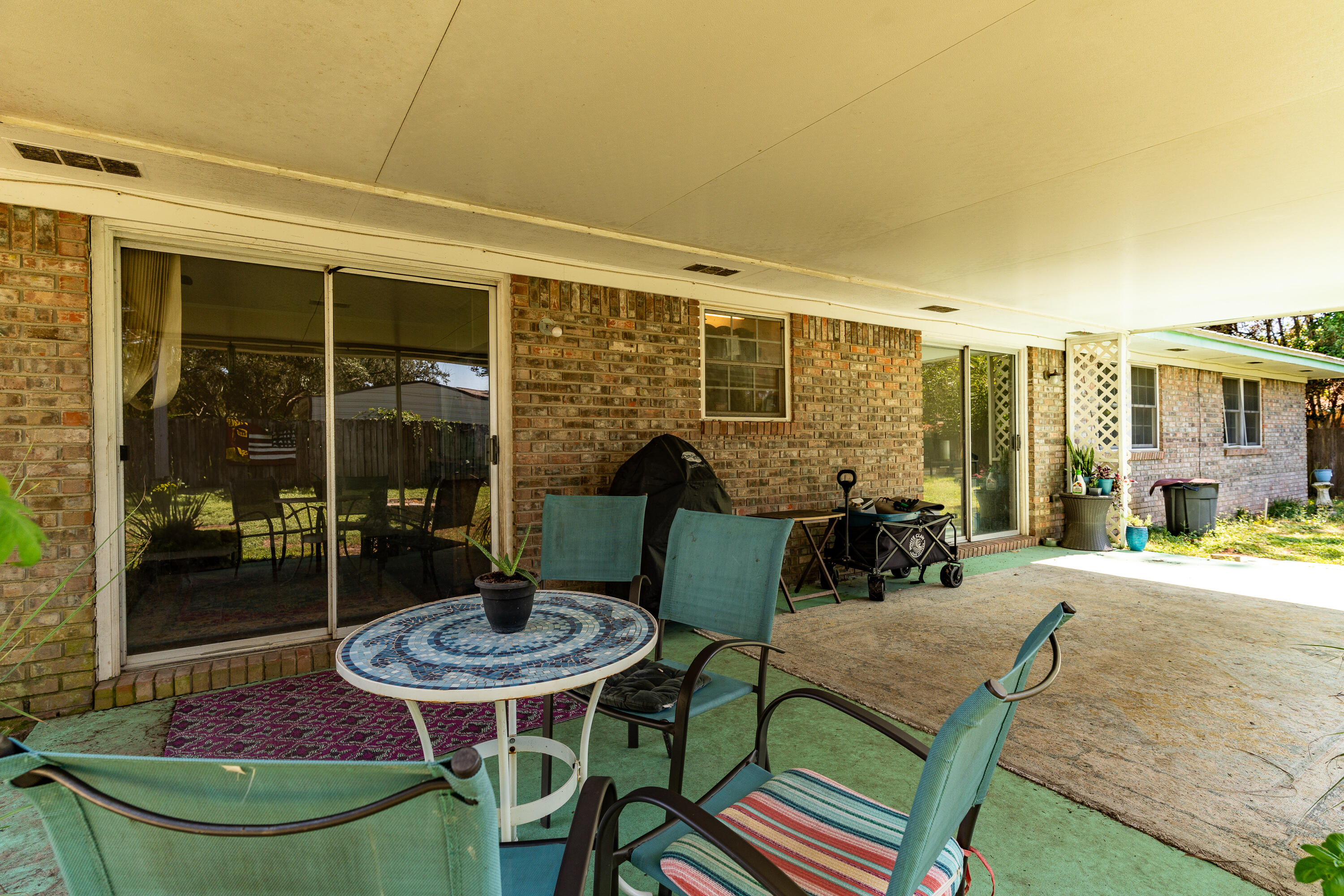 35 James Avenue Shalimar, FL 32579 - Photo 36 of 44 a backyard of a house with table and chairs