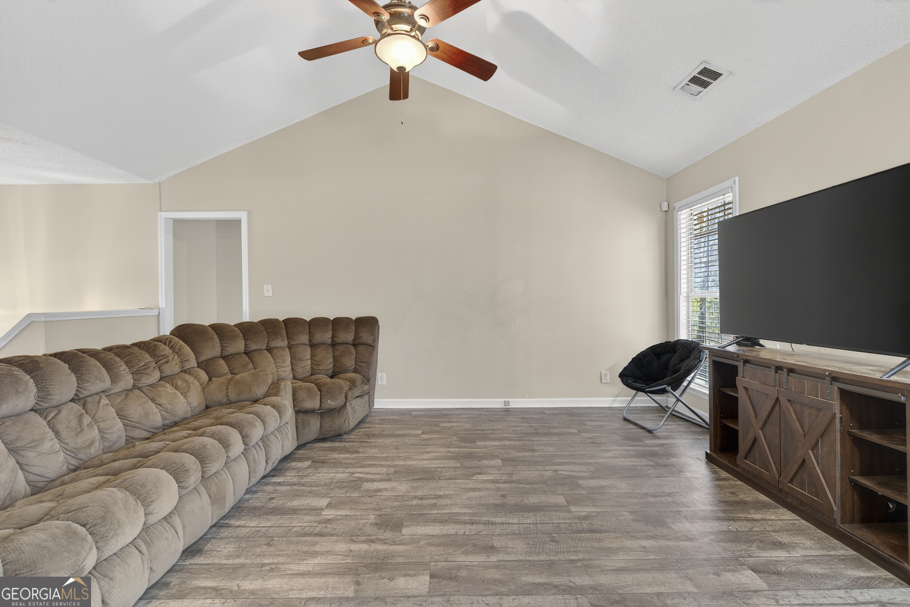 226 Amy Lane Gray, GA 31032 - Photo 11 of 46 a living room with furniture and a flat screen tv