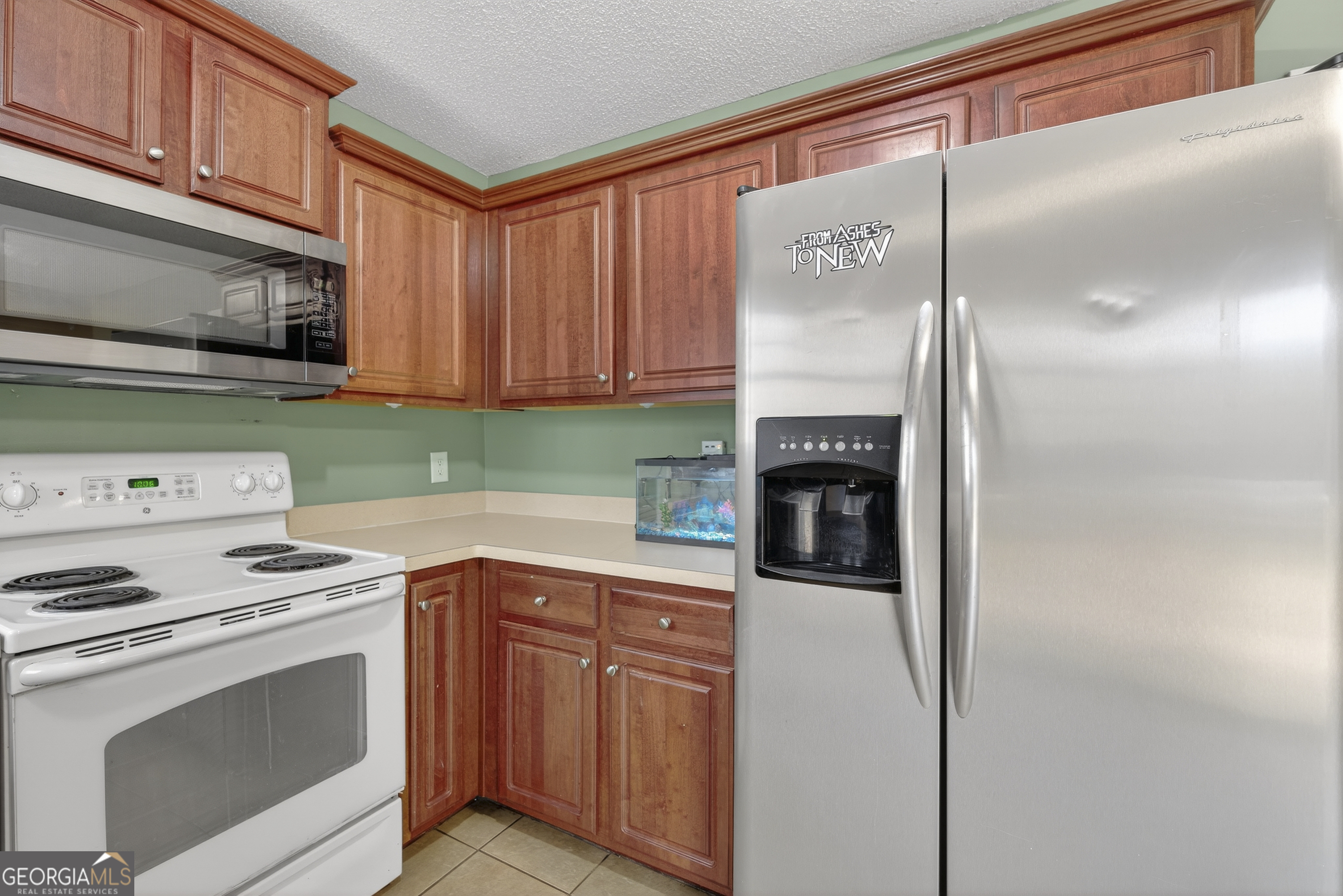 226 Amy Lane Gray, GA 31032 - Photo 18 of 46 a kitchen with granite countertop a stove top oven and cabinets