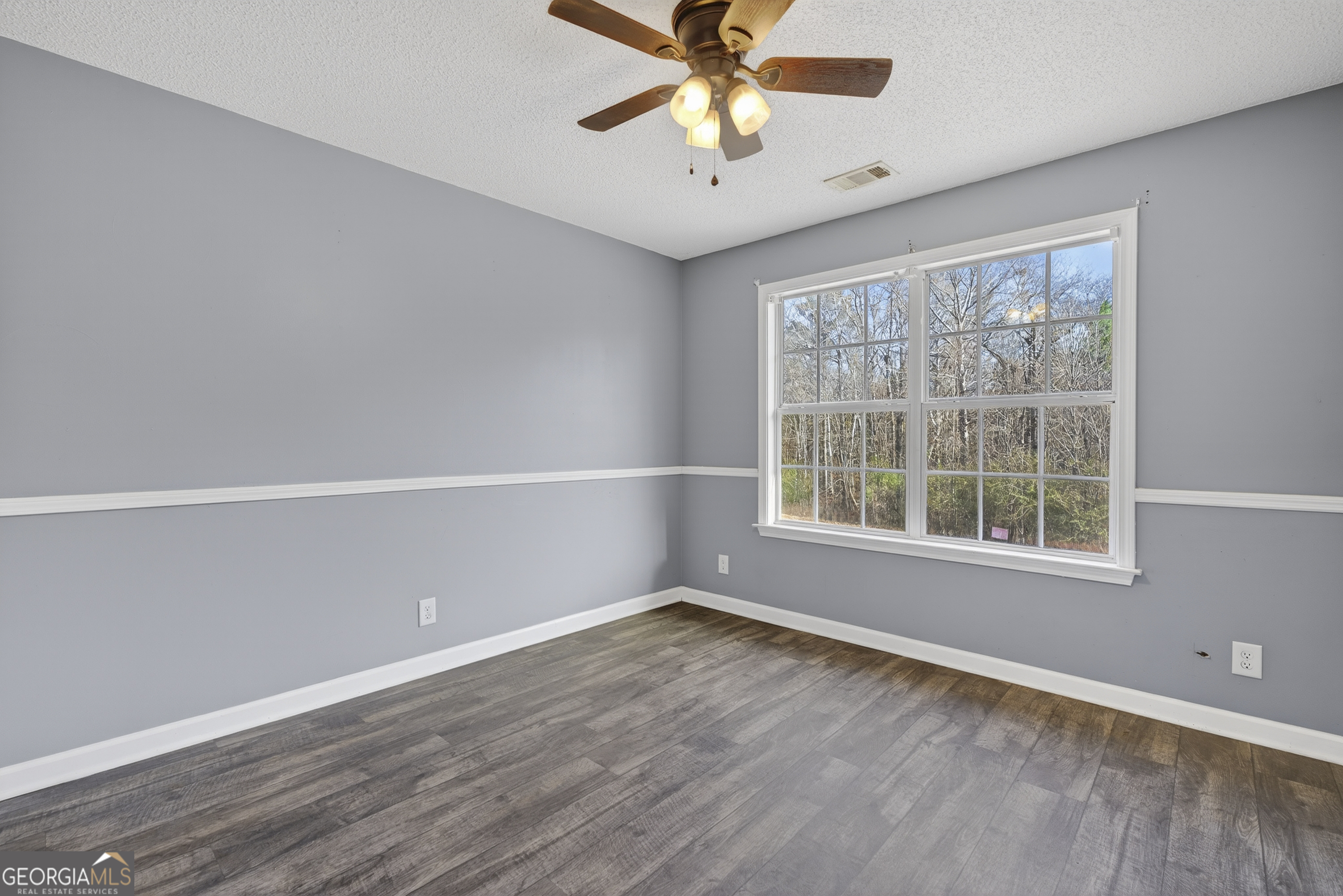 226 Amy Lane Gray, GA 31032 - Photo 23 of 46 an empty room with a window and a fan