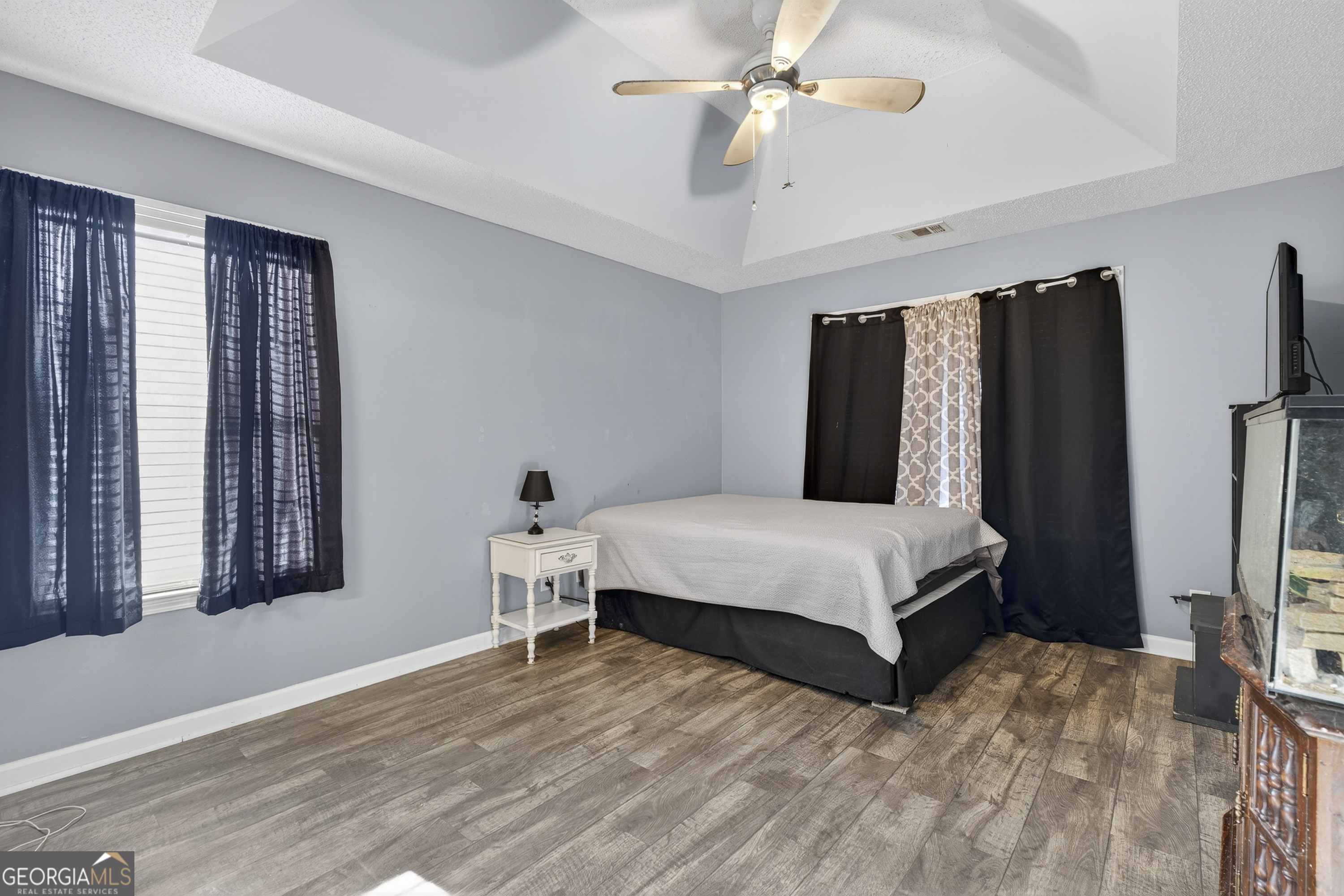 226 Amy Lane Gray, GA 31032 - Photo 26 of 46 a bedroom with a bed lamps and a large mirror