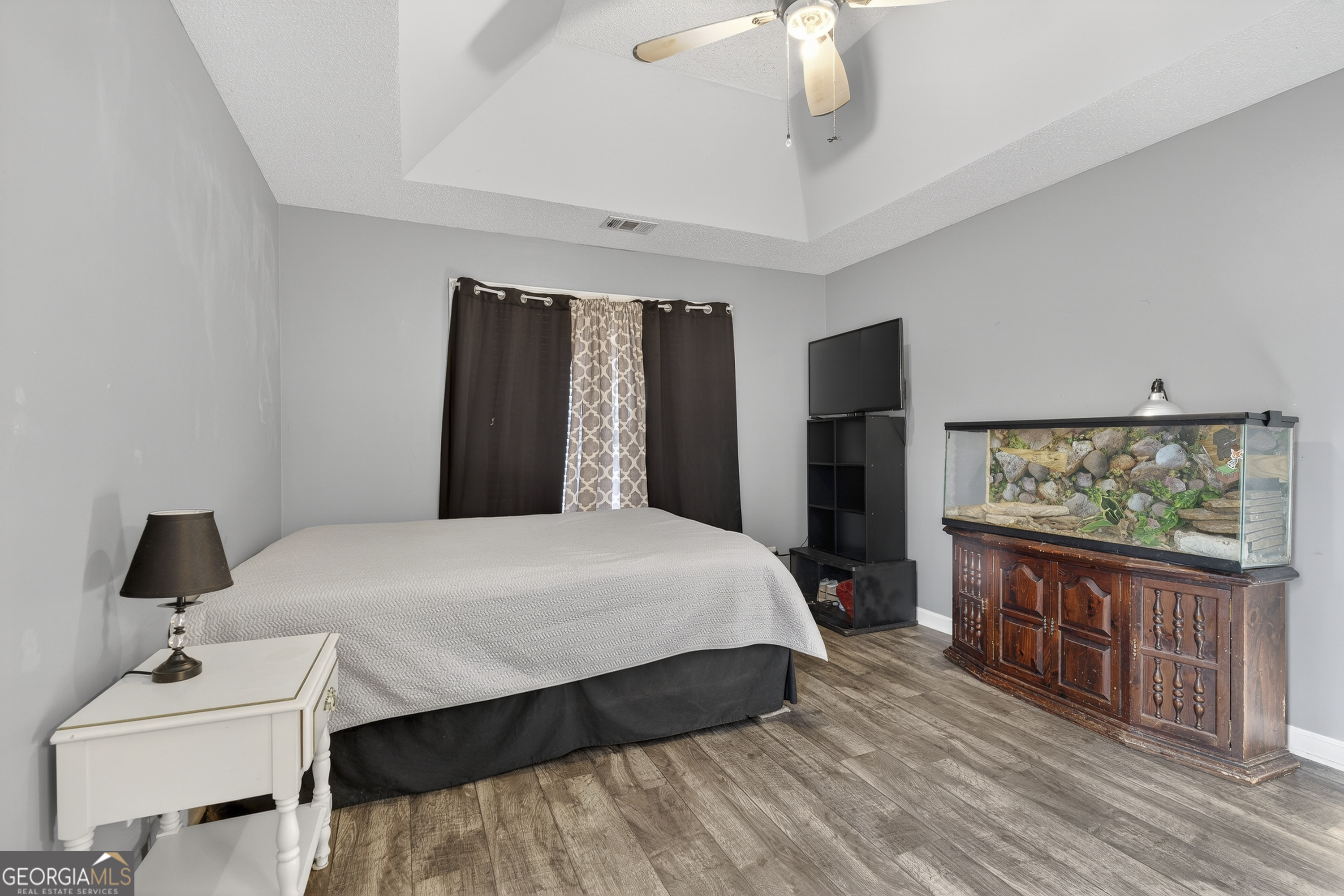 226 Amy Lane Gray, GA 31032 - Photo 27 of 46 a bedroom with a bed and a flat tv screen on dresser