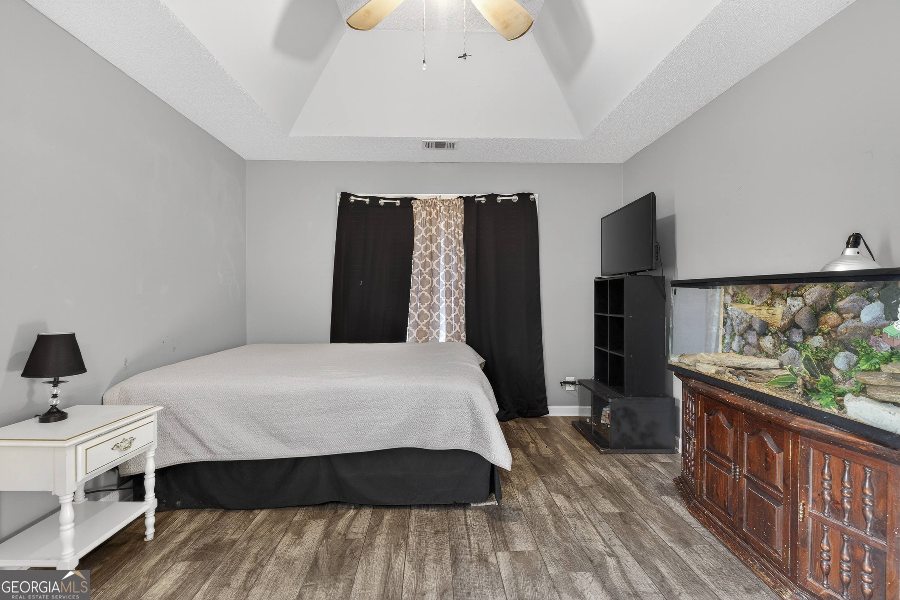 226 Amy Lane Gray, GA 31032 - Photo 28 of 46 a bedroom with a bed and wooden floor