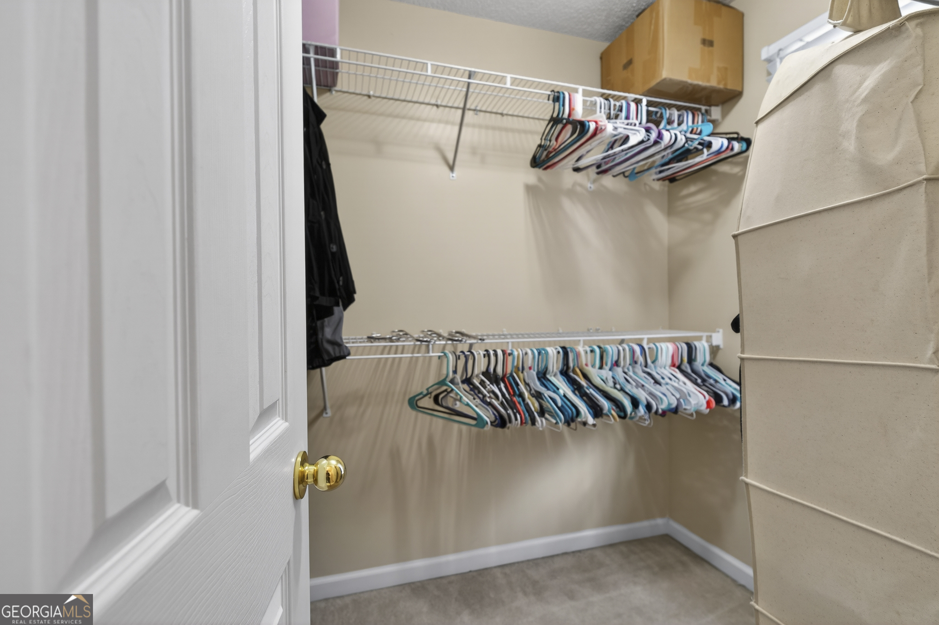 226 Amy Lane Gray, GA 31032 - Photo 32 of 46 a view of walk in closet with clothes and shoes