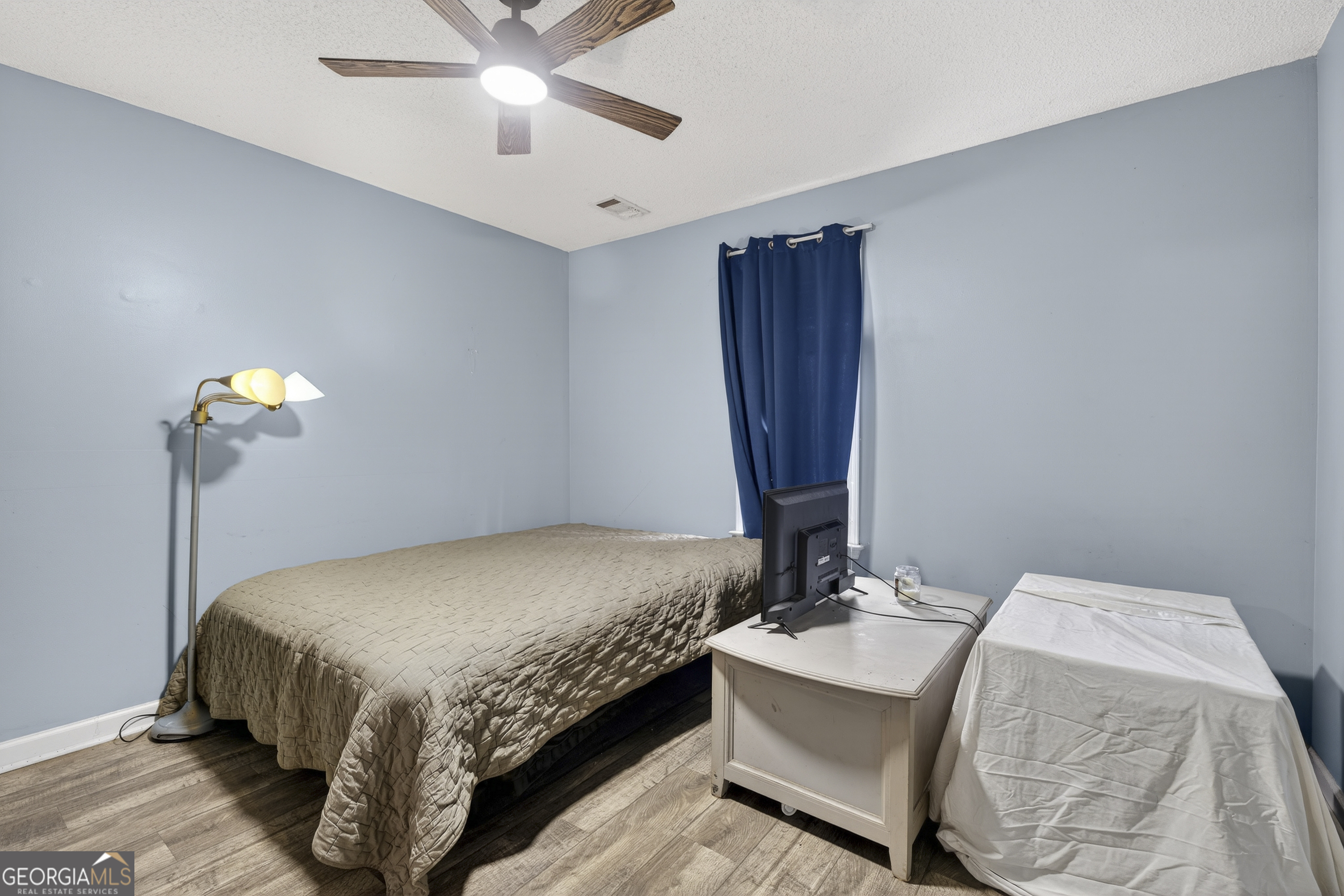 226 Amy Lane Gray, GA 31032 - Photo 37 of 46 a bedroom with a bed and chandelier