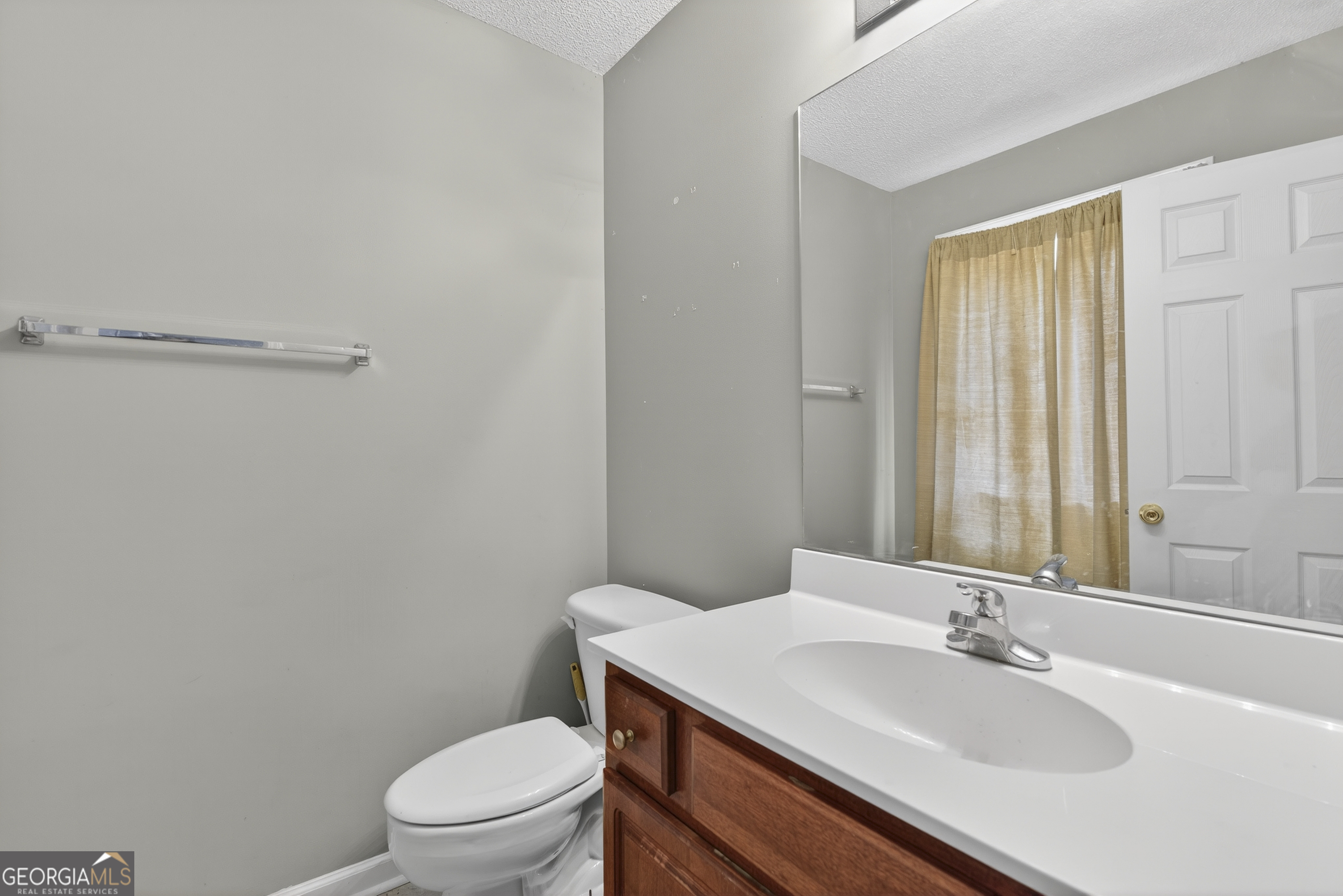 226 Amy Lane Gray, GA 31032 - Photo 38 of 46 a bathroom with a sink a toilet and a mirror