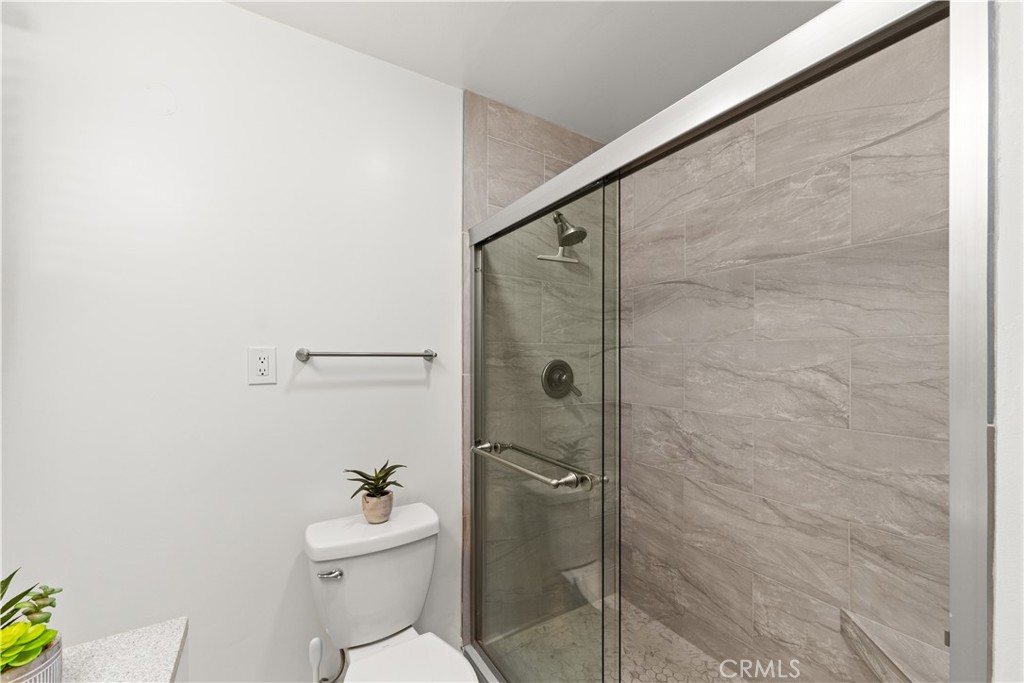 17042 Rorimer Street La Puente, CA 91744 - Photo 16 of 31 Step in shower with bench.