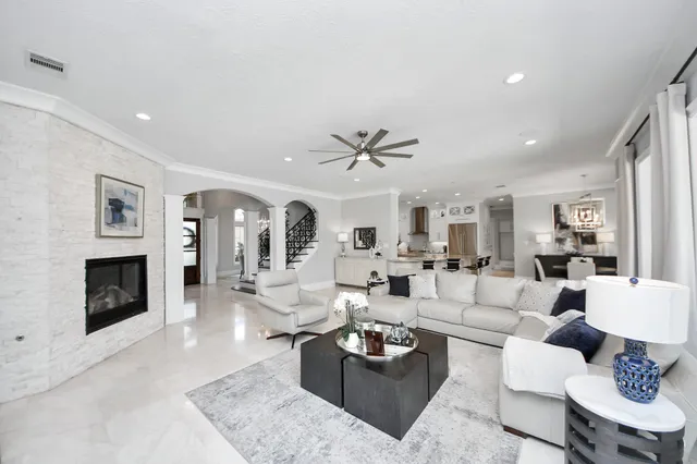 a living room with fireplace furniture and a fireplace