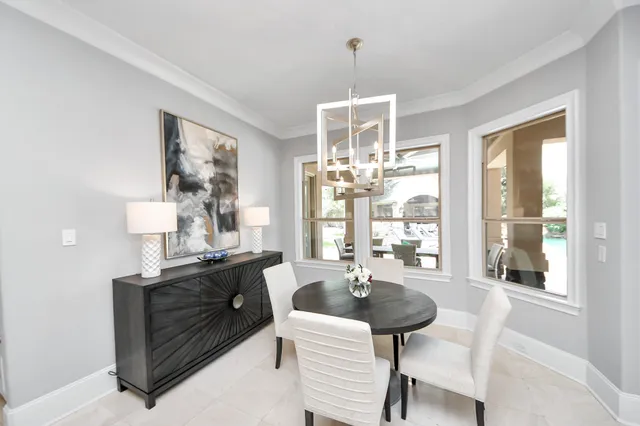 a dining room with furniture and window