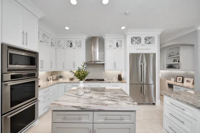 a kitchen with granite countertop stainless steel appliances and counter space