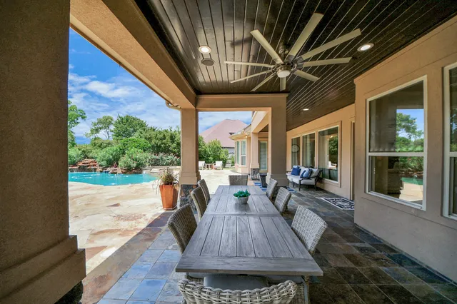 a view of a porch with furniture and yard