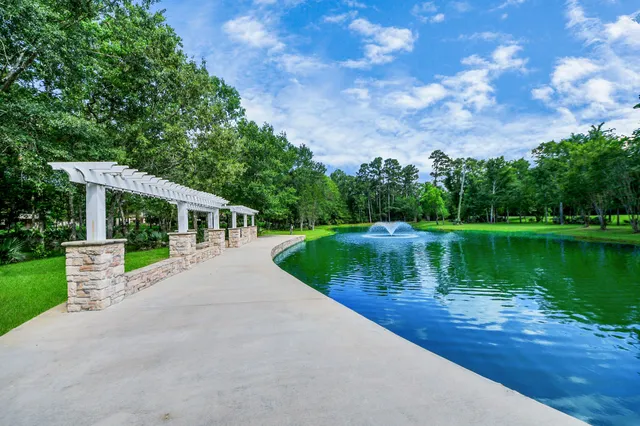 $1,350,000 | 6302 South Royal Point Drive, Kingwood, TX 77345