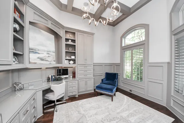 a living room with furniture a fireplace and windows