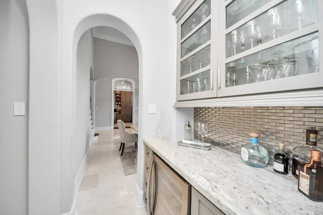 a bathroom with a granite countertop sink a toilet and with a vanity