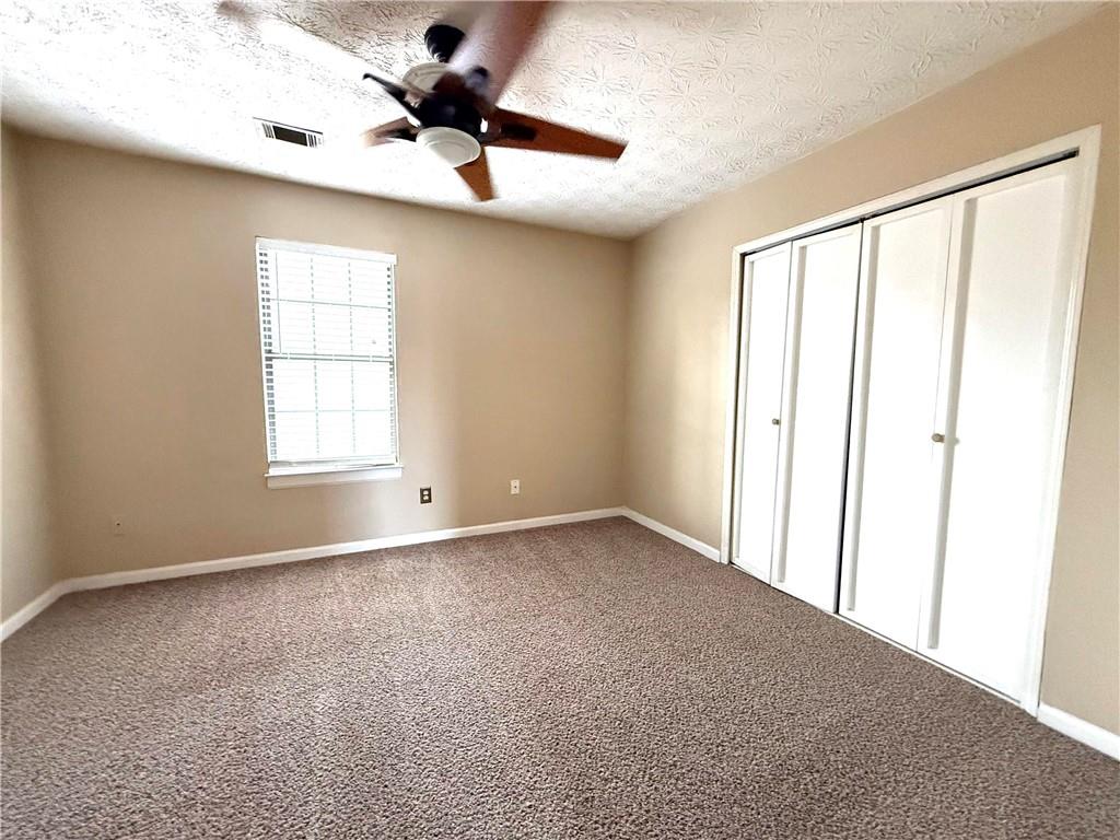 1555 Springleaf Court Southeast Smyrna, GA 30080 - Photo 14 of 19 a view of an empty room with a window
