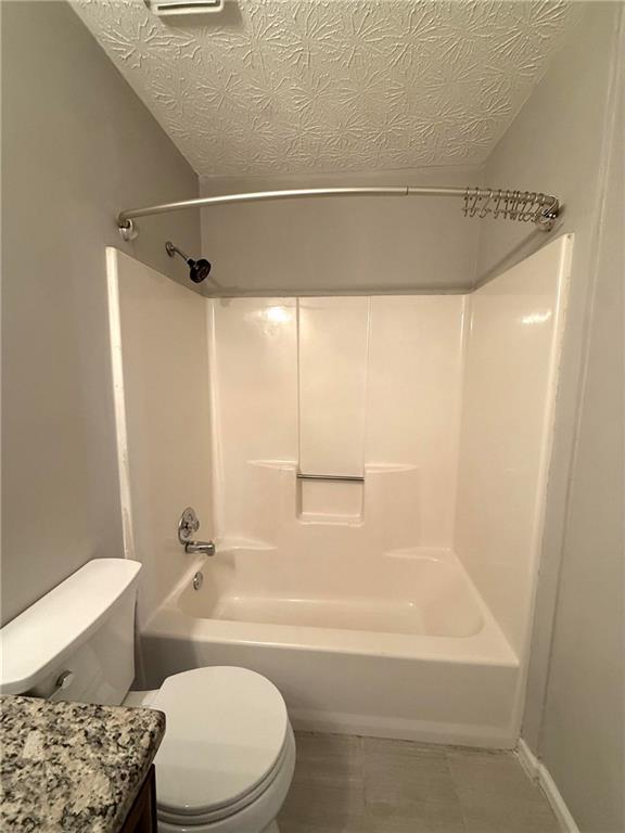 1555 Springleaf Court Southeast Smyrna, GA 30080 - Photo 16 of 19 a bathroom with a toilet and a bathtub