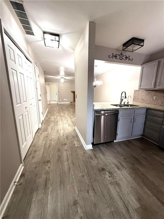 1555 Springleaf Court Southeast Smyrna, GA 30080 - Photo 2 of 19 a view of a kitchen with a sink and wooden floor