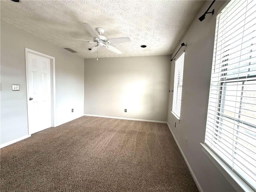 1555 Springleaf Court Southeast Smyrna, GA 30080 - Photo 9 of 19 a view of an empty room and window