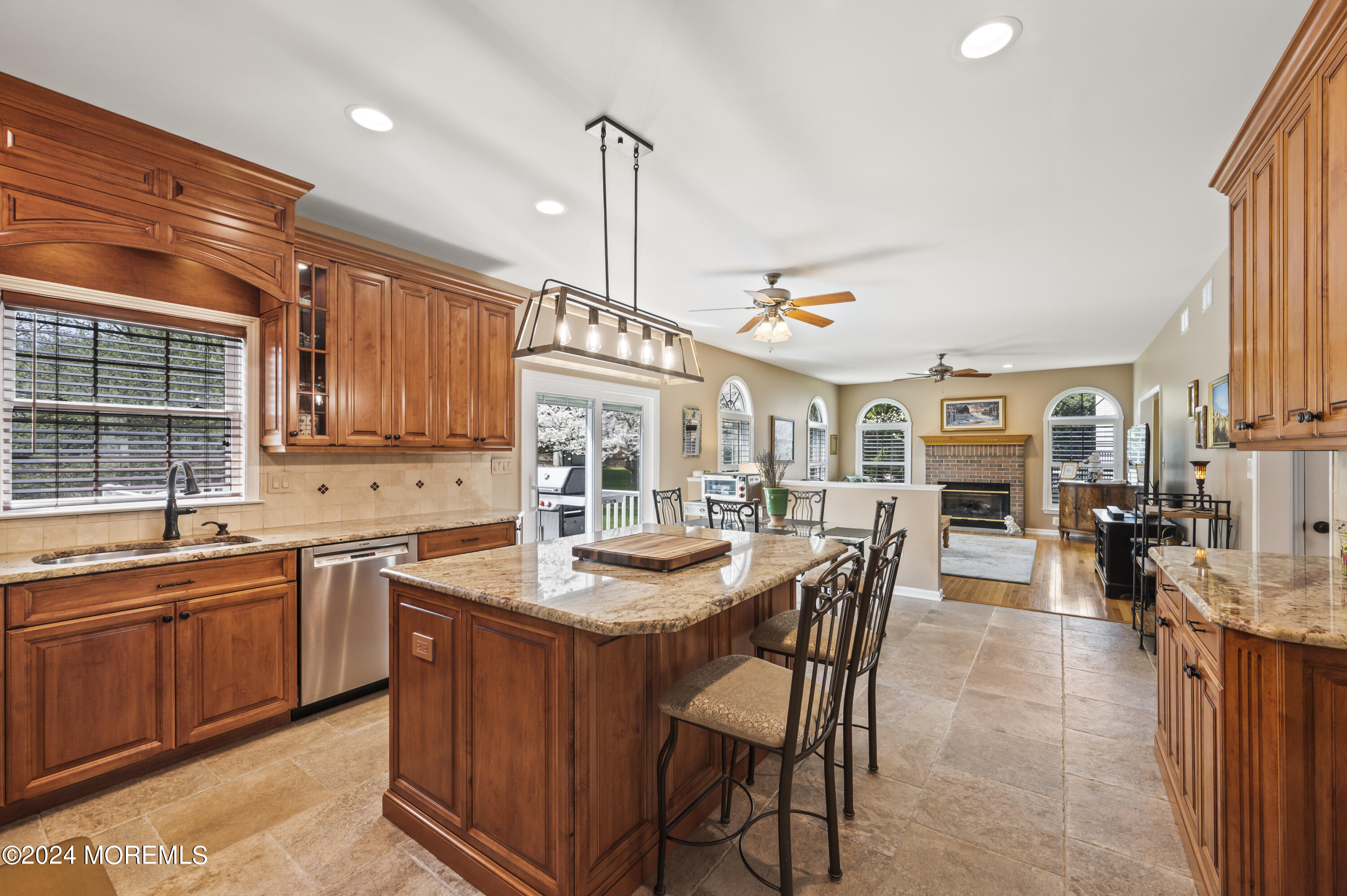 2805 Newman Way Wall, NJ 07719 - Photo 11 of 31 a kitchen with stainless steel appliances granite countertop a sink and a refrigerator