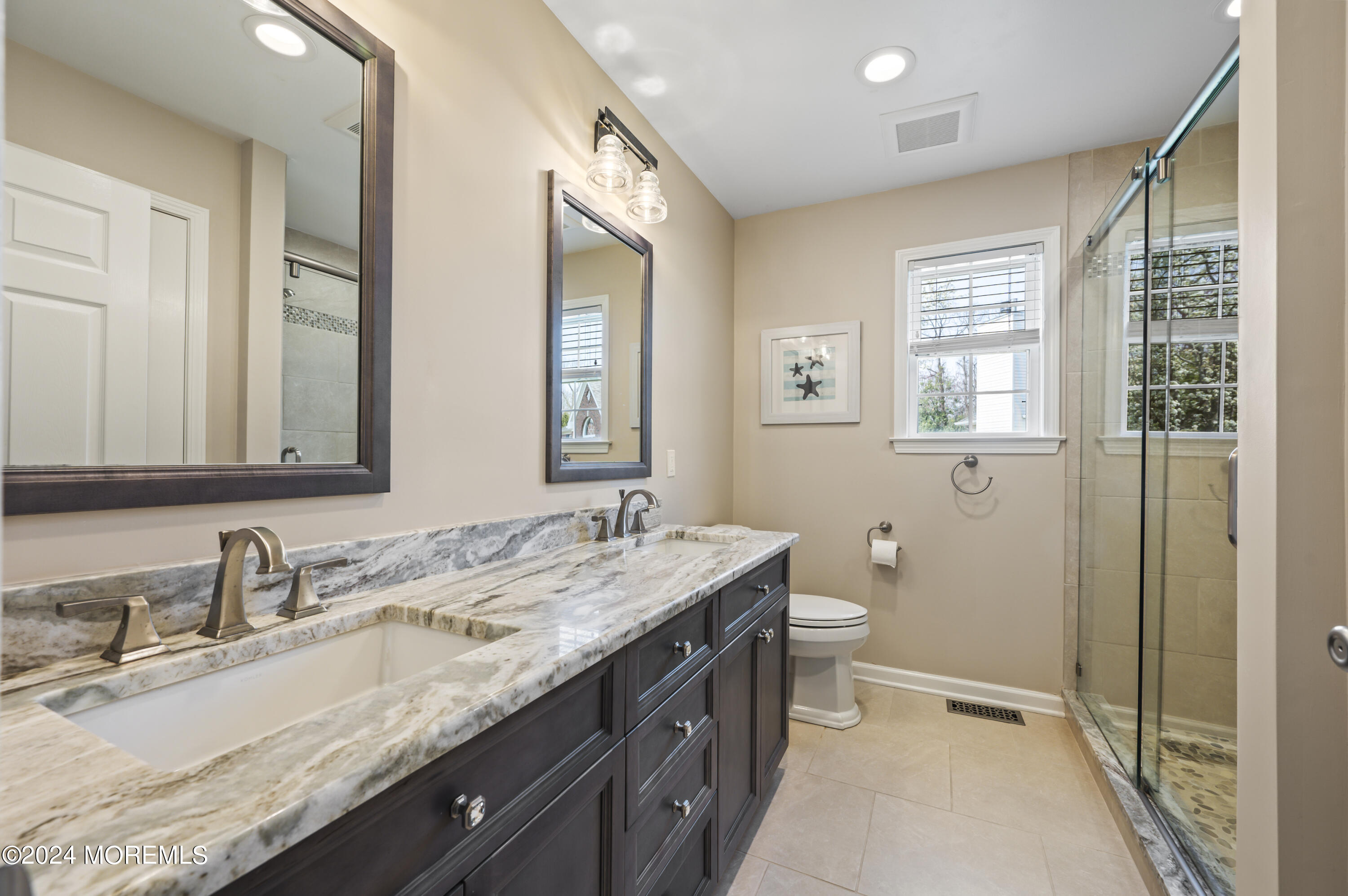 2805 Newman Way Wall, NJ 07719 - Photo 20 of 31 a bathroom with a granite countertop double vanity sink a mirror and a toilet