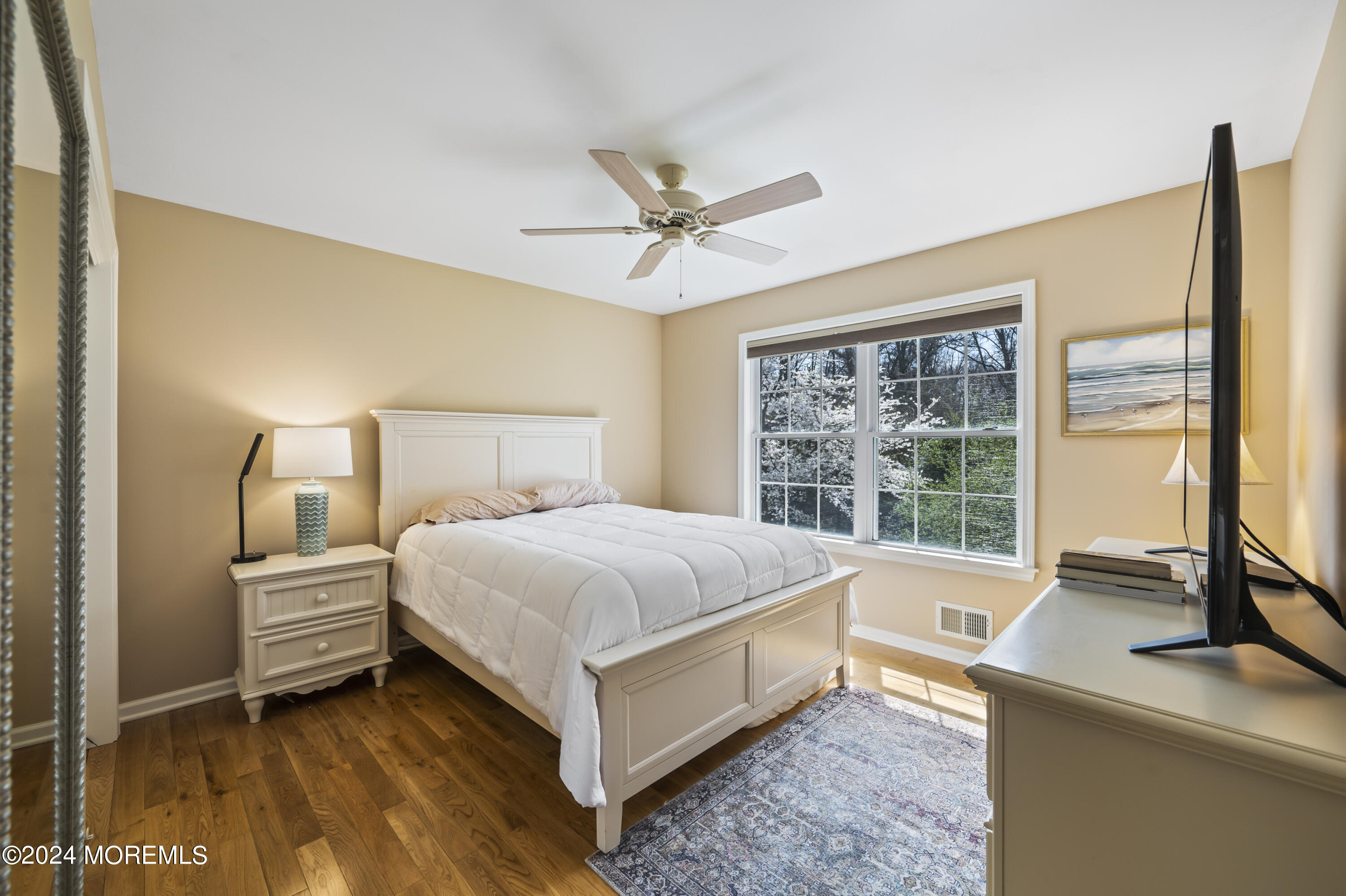 2805 Newman Way Wall, NJ 07719 - Photo 21 of 31 a bedroom with a bed and large windows