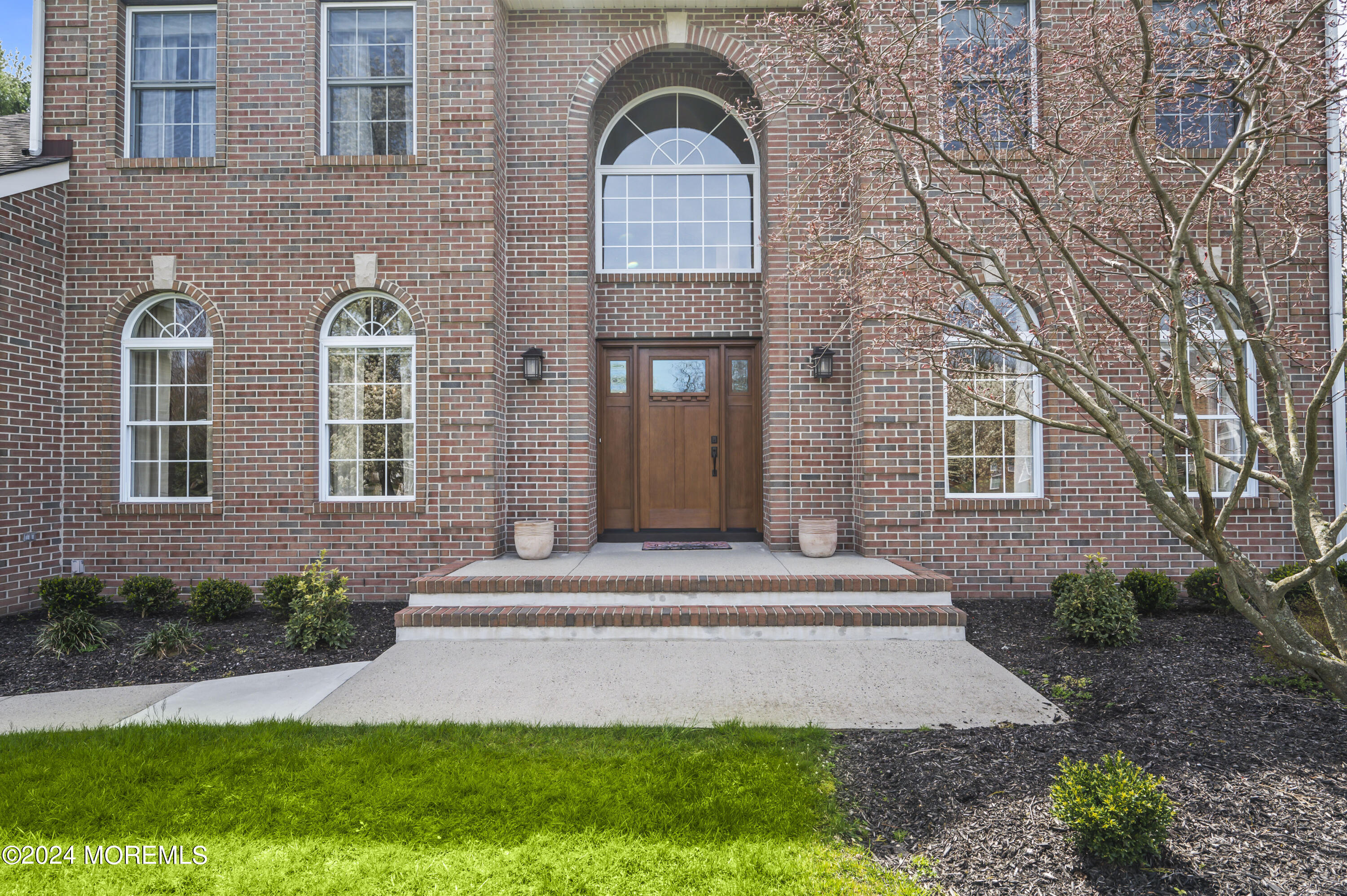 2805 Newman Way Wall, NJ 07719 - Photo 8 of 31 a front view of a house with a garden