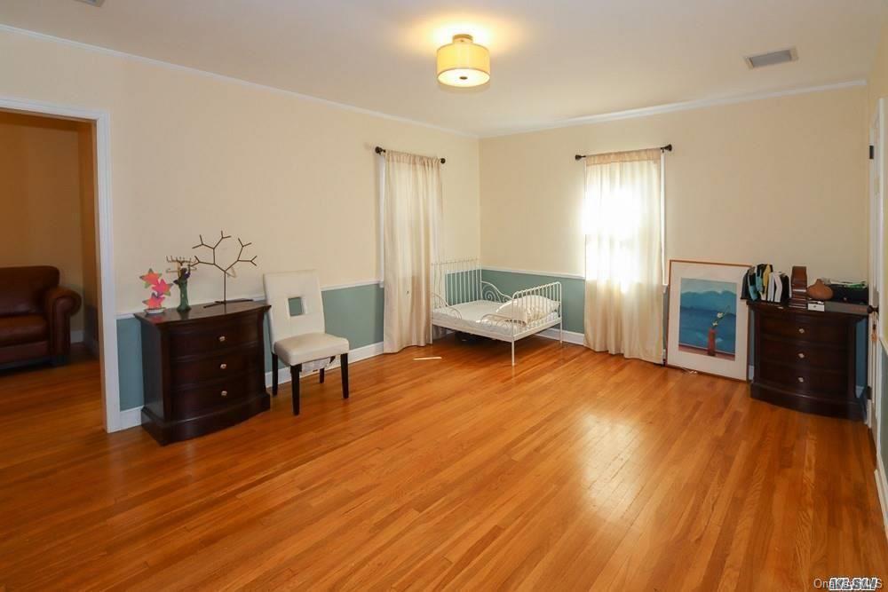 80-76 Springfield Boulevard Queens, NY 11427 - Photo 11 of 21 a living room with furniture and wooden floor