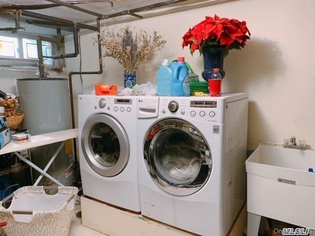 80-76 Springfield Boulevard Queens, NY 11427 - Photo 19 of 21 a utility room with dryer and washer