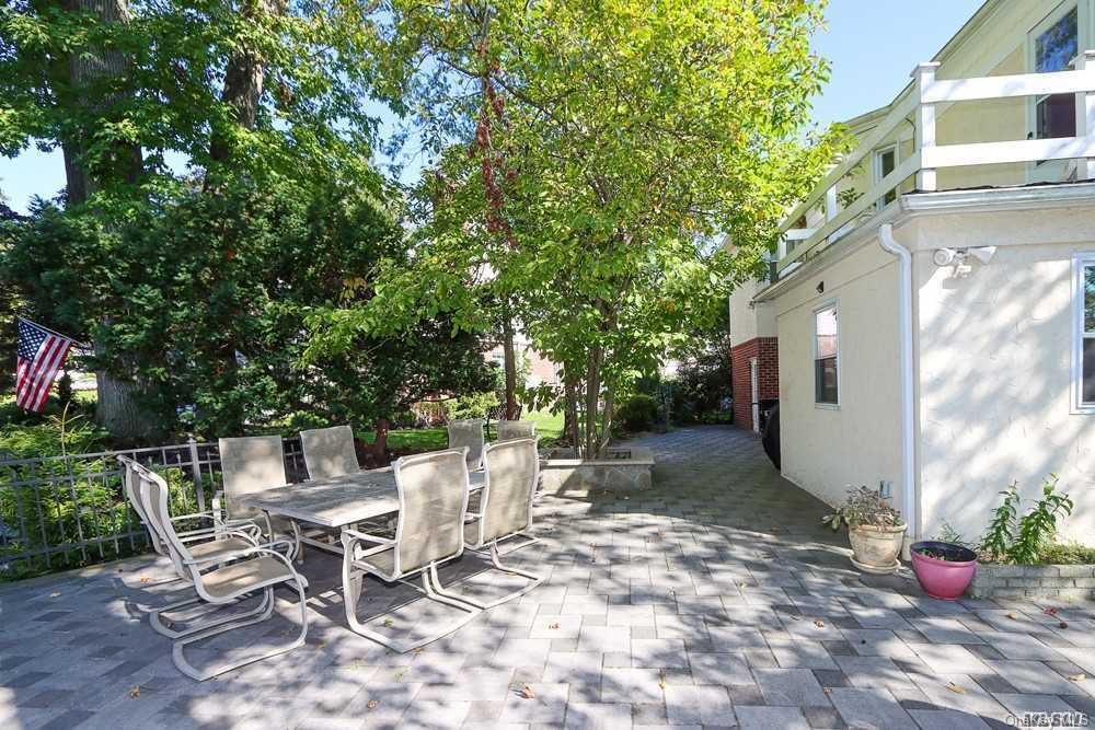 80-76 Springfield Boulevard Queens, NY 11427 - Photo 20 of 21 a view of a patio with table and chairs and potted plants