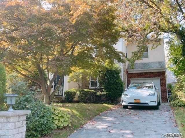80-76 Springfield Boulevard Queens, NY 11427 - Photo 4 of 21 a view of car parked in front of house