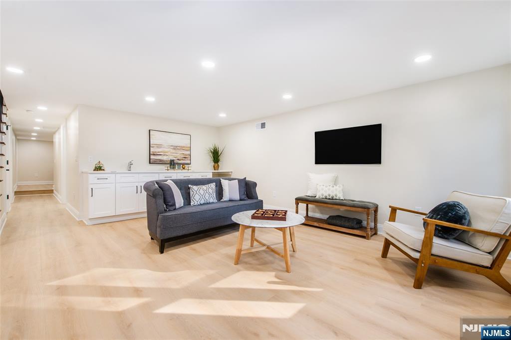 145 Grove Street Mahwah, NJ 07430 - Photo 22 of 30 a living room with furniture and a flat screen tv